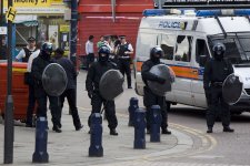 1920px-Police_with_riot_shields_in_Lewisham,_2011.jpg